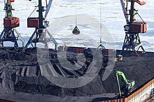 Open-pit coal loading at the port of Vladivostok.