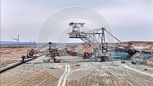 Open pit coal mine with huge backhoe digger
