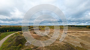 Open pit gravel mining. Limestone quarry, mining rocks and stones photographed from above with a drone.