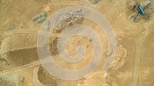 Open pit gravel mining. Limestone quarry, mining rocks and stones photographed from above with a drone.