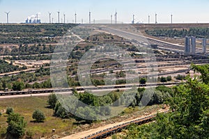 Open pit mine with conveyor belts transporting coal to powerplant