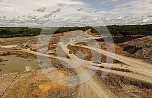 Open pit mine industry, mining traffic for coal, top view aerial drone.