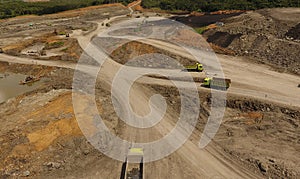 Open pit mine industry, mining traffic for coal, top view aerial drone.