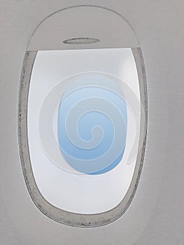 Open Plane window shade with blue area for copy space