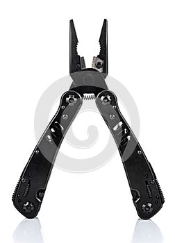 Open pliers of black multi tool knife isolated on white background with reflection on glossy surface. Multipurpose knife close-up