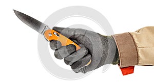 Open pocket folding knife with bright orange handle in worker hand in black protective glove and brown uniform isolated on white