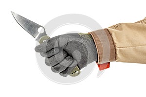 Open pocket folding knife with dark green handle in worker hand in black protective glove and brown uniform isolated on white