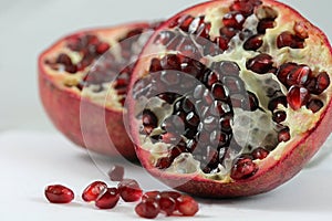 Open pomegranate on white background