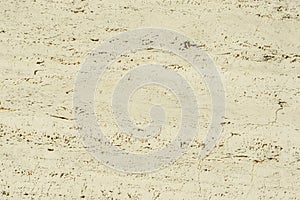 Open-pore surface of a travertine stone with different pattern, texture and structure, is very suitable as a background for photo