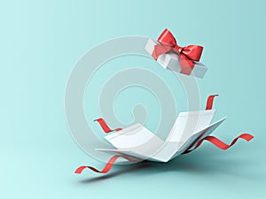 Open present box or gift box with red ribbons and bow isolated on green blue pastel color background