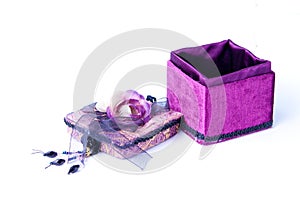 Open purple gift box with a rose isolated.