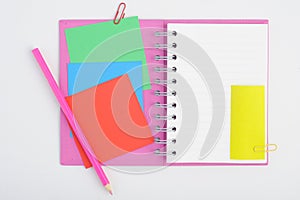 Open Purple Notebook with color post it and pencil