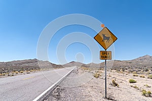 Open Range road sign warning drivers of cattle and cows near the highway