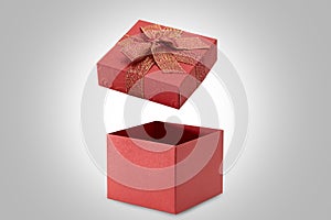 Open red gift box on gray background