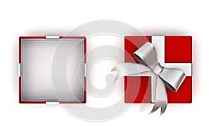 Open red gift box or present box with silver ribbon bow and empty space in the box isolated on white background with lid . 3D rend