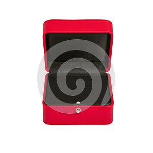 Open red jewelry gift box with black velvet inside isolated on white background close-up, shallow depth of field