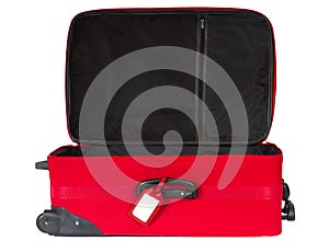 Open red suitcase with blank tag over white.