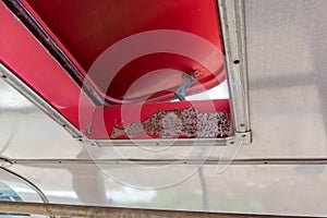 Open red sunroof, hatch of a passenger bus