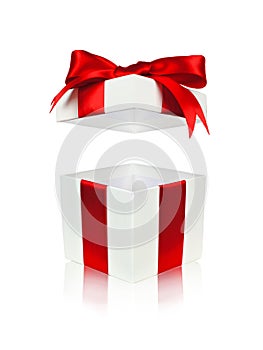 Open red and white gift box with floating lid