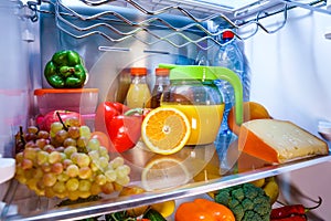 Open refrigerator filled with food