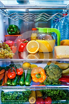 Open refrigerator filled with food