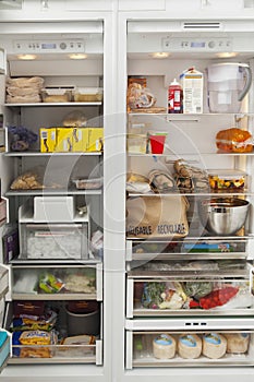 Open Refrigerator With Food Items