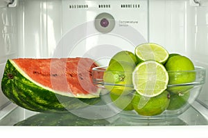 Open refrigerator with fruits