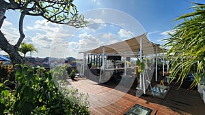 An open rooftop bar with a membrane canopy