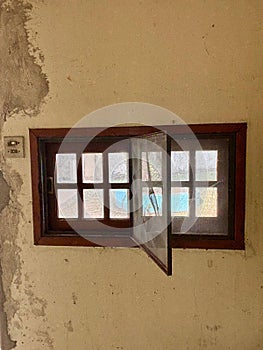 Open rustic window with screen photo