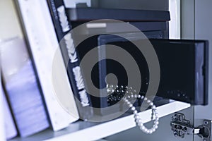 Open safe with expensive jewellery