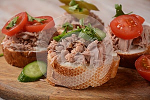 Open sandwich with canned tuna, cucumber, tomatoes