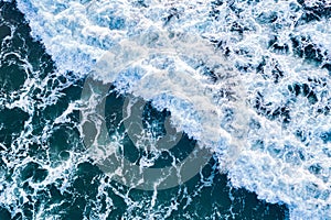 Open sea from aerial top view. Blue water frothy indonesia ocean surface with big wave