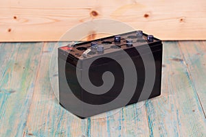 Open Sealed battery on wwood background