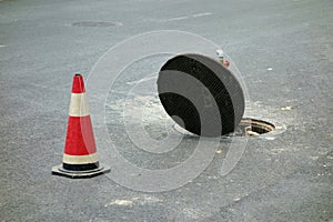 Open sewer manhole photo
