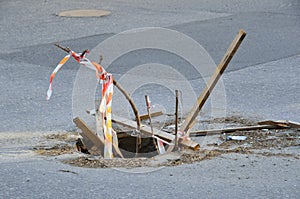 Open sewer well on the roadway