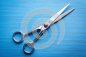 Open shears on a blue background