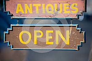 Open sign of antiques store photo