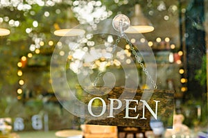 Open sign board at coffee shop.