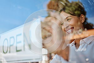 Open sign, coffee shop and woman opening small business feeling proud as manager, owner or employee excited to start