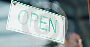 Open sign, front door and happy restaurant man, small business owner or boss start work day of commerce service industry