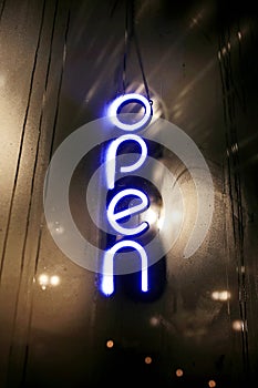 Open Sign Glowing in Small Restaurant Window on Dark Winter Night