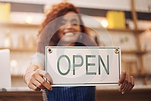 Open sign, hands and woman in shop, store and advertising notice of retail shopping time, board or trading information