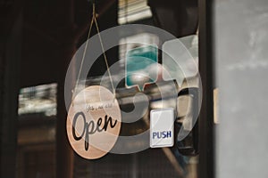 open sign hanging outside a restaurant, store, office or other..