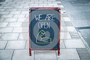 Open sign outside a shop