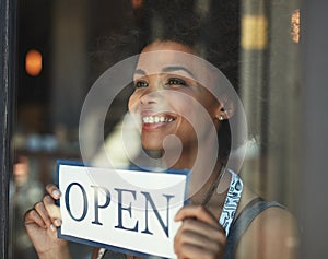 Open sign, restaurant store window and happy woman, small business owner or manager with cafe poster for welcome