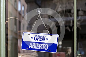 Open sign in Spanish and English photo