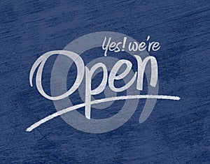Open sign text over blue background