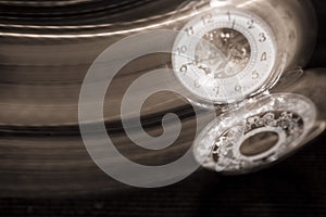 Pocket watch swinging on chain with motion blur trail