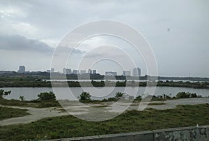 Open space area with greenery and reservoir at sepang malaysia