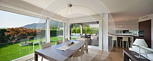 Open space of luxury house, dining table